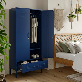 Metal, tall, double-door and single-drawer storage locker in navy blue, open showing clothes and shoes, in a bedroom
